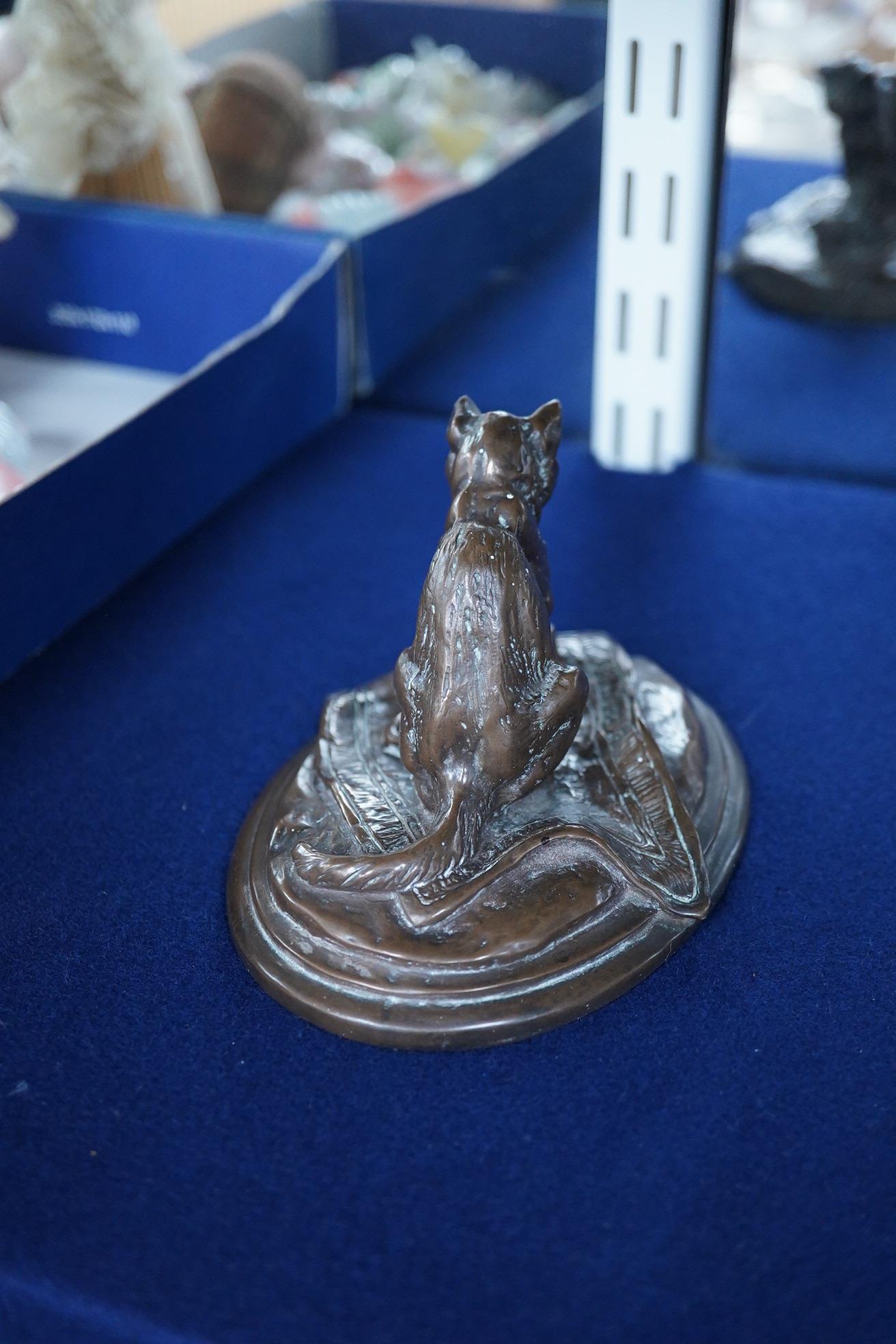 After Emmanuel Fremiet (1824-1910), a study of a seated cat, signed, 13cm wide